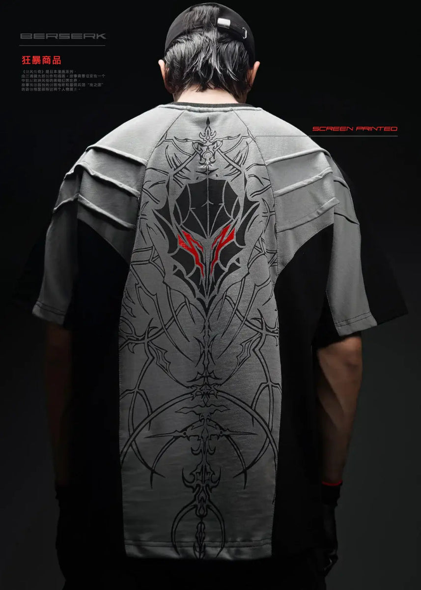 Person wearing a t-shirt with a detailed design on the back against a dark background