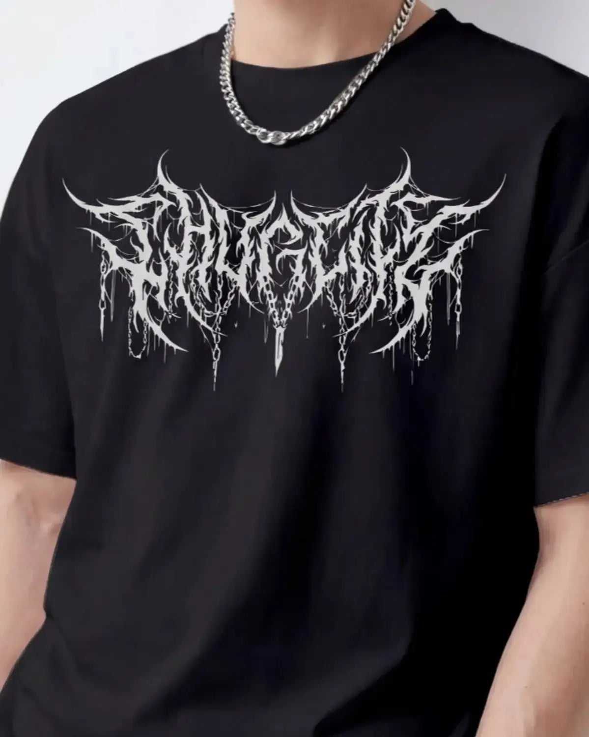 Detailed front view of a black oversized cotton T-shirt with a metal logo graphic print.