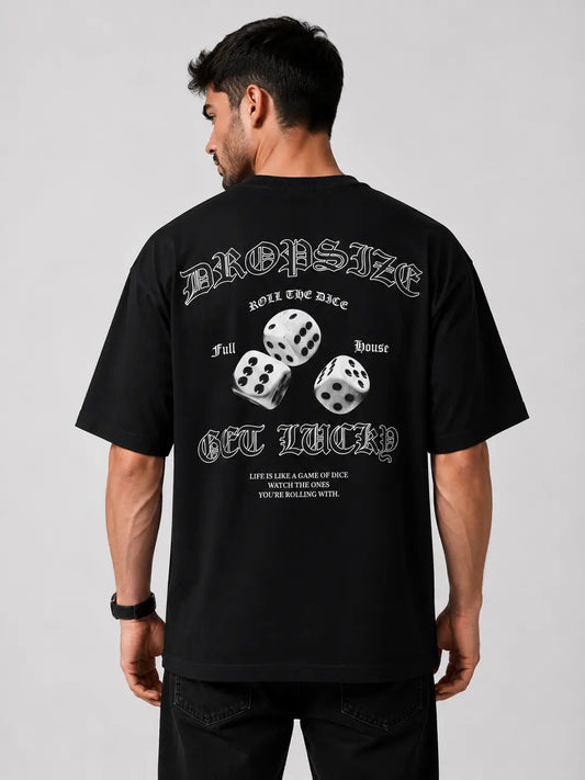 Back view of a black oversized T-shirt featuring a bold dice graphic print with typography on the back